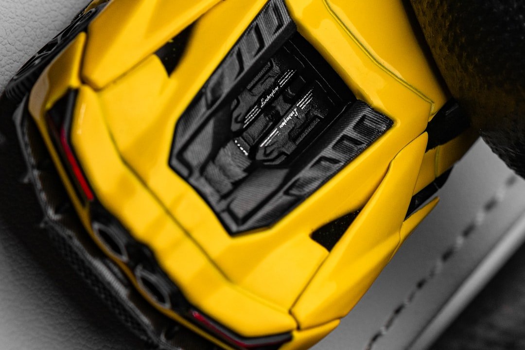 A yellow toy car with black accents
