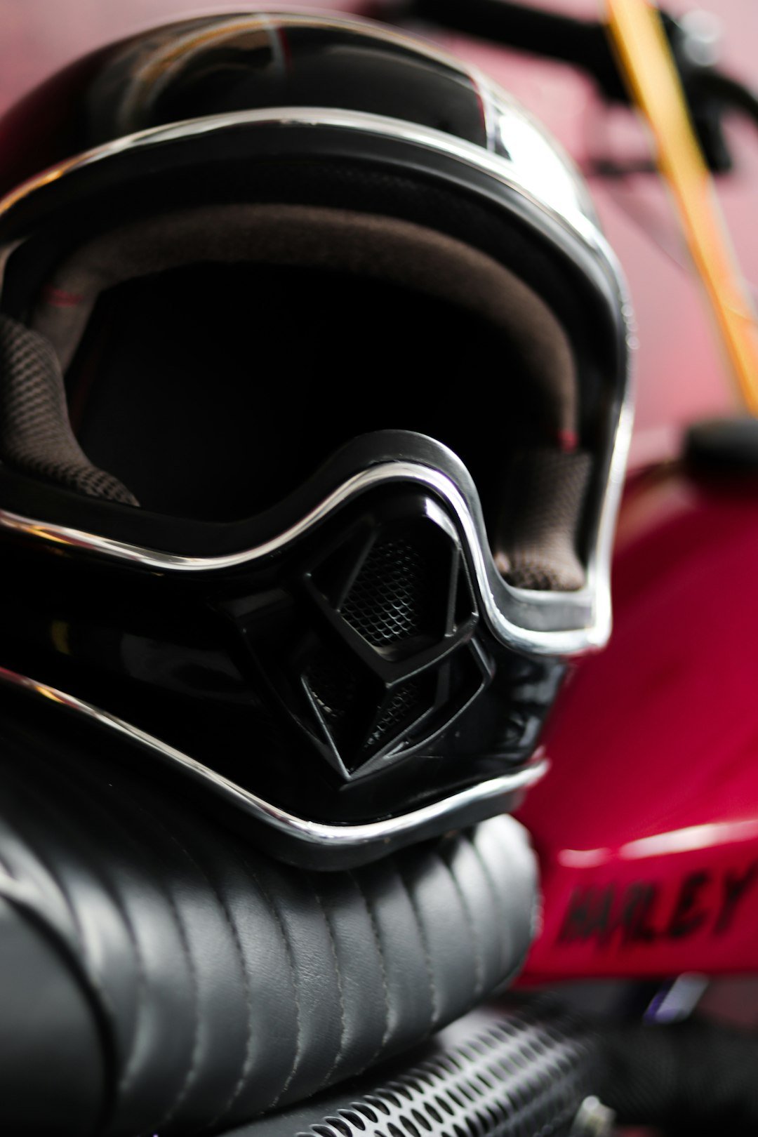 black and white helmet on red textile