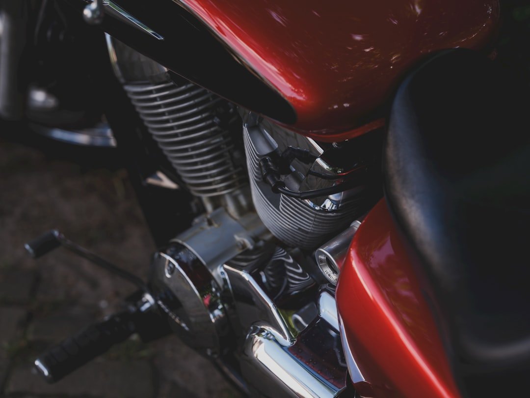 Close-up of a shiny, red motorcycle.