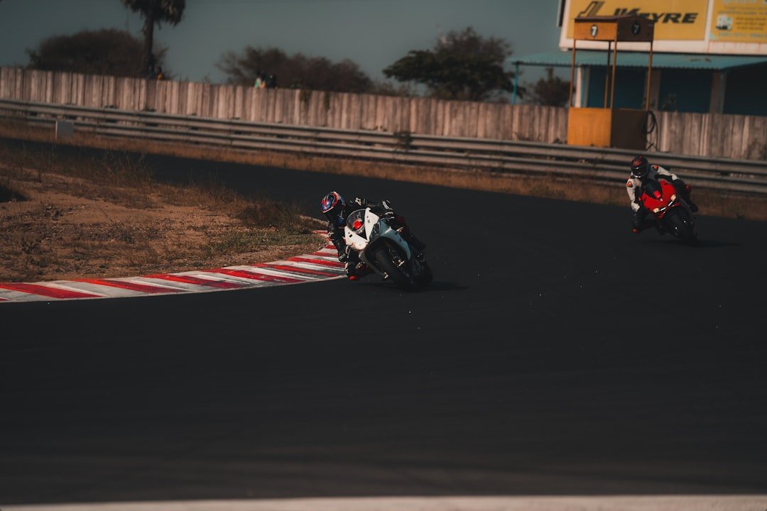 man riding motorcycle on road during daytime