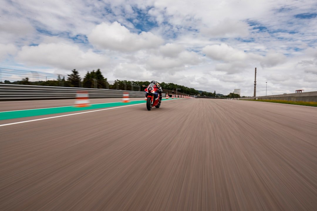 a person riding a motorcycle on a race track